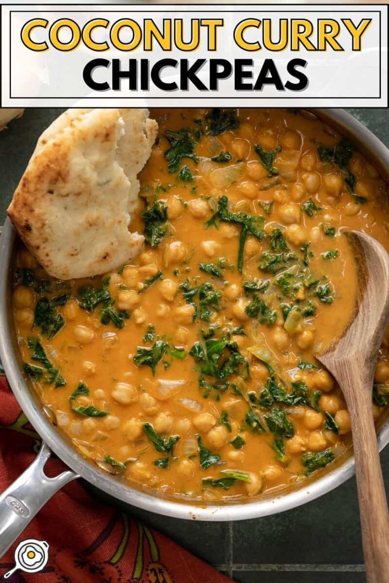 Close up overhead view of a skillet full of coconut curry chickpeas.