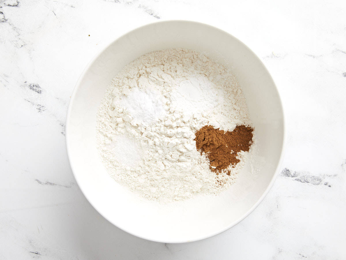 Dry ingredients for pumpkin muffins in a bowl, not mixed together.