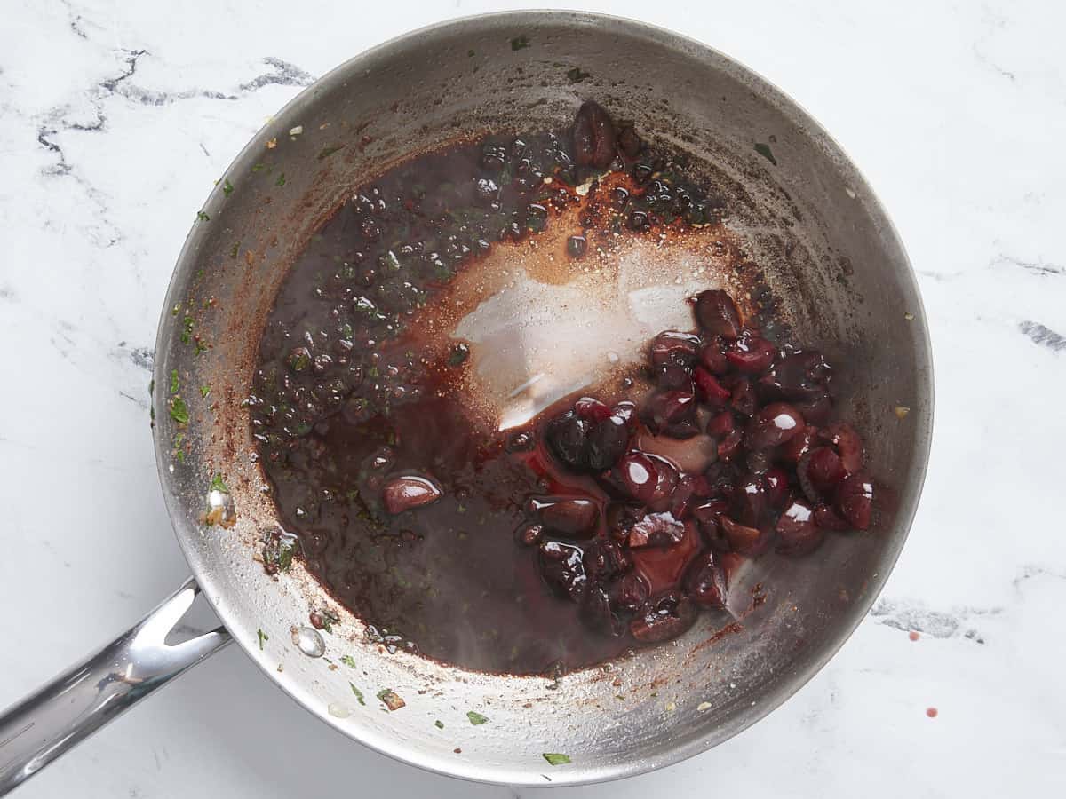 Reduced red wine sauce in the skillet.