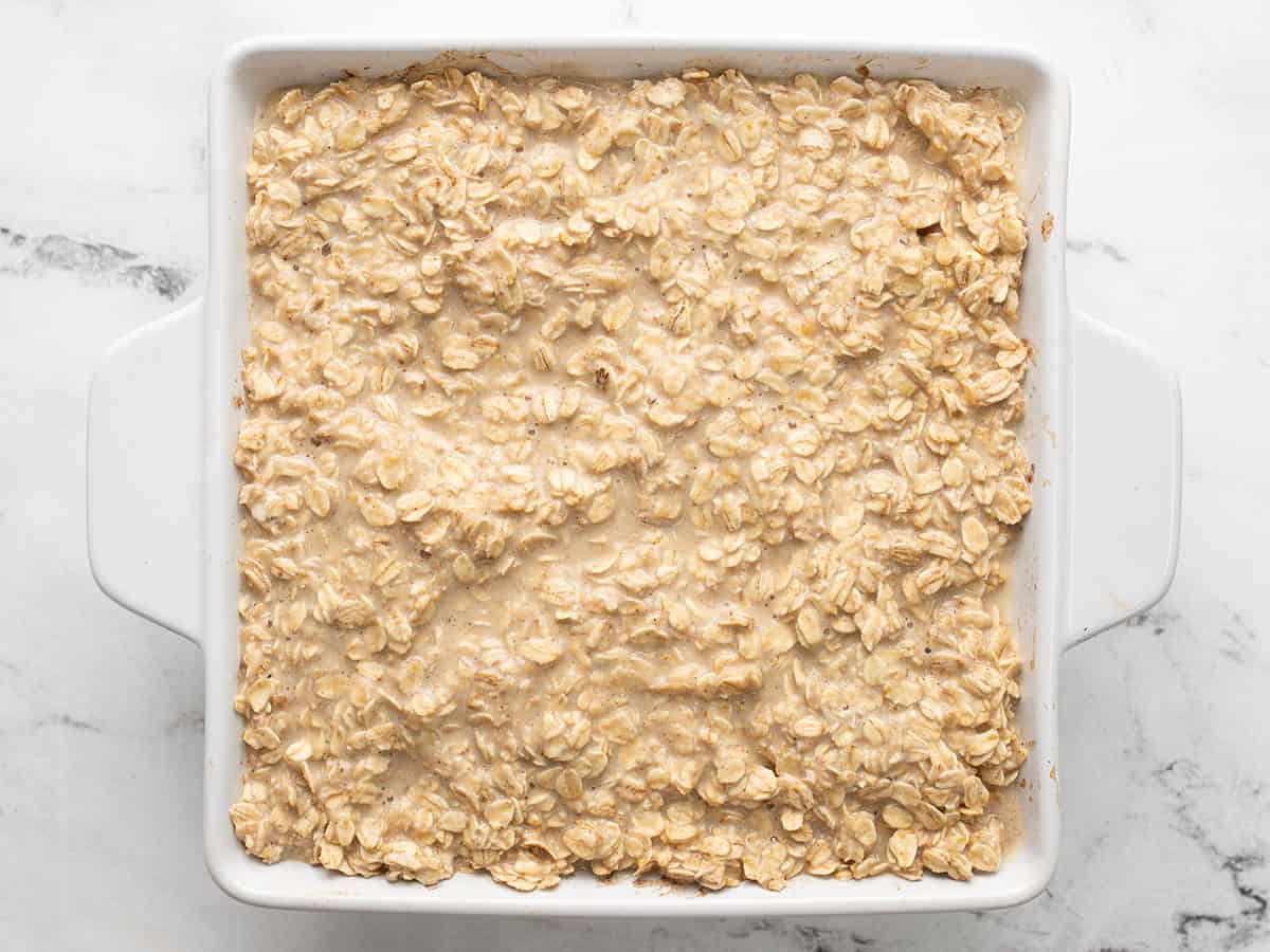 Oat mixture in the casserole dish on top of the baked apples.