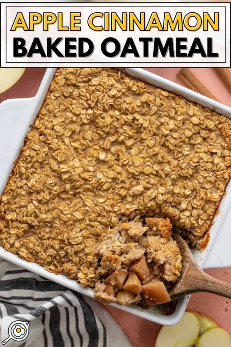 Overhead view of a casserole dish with apple cinnamon baked oatmeal, the corner scooped out with a wooden spoon.