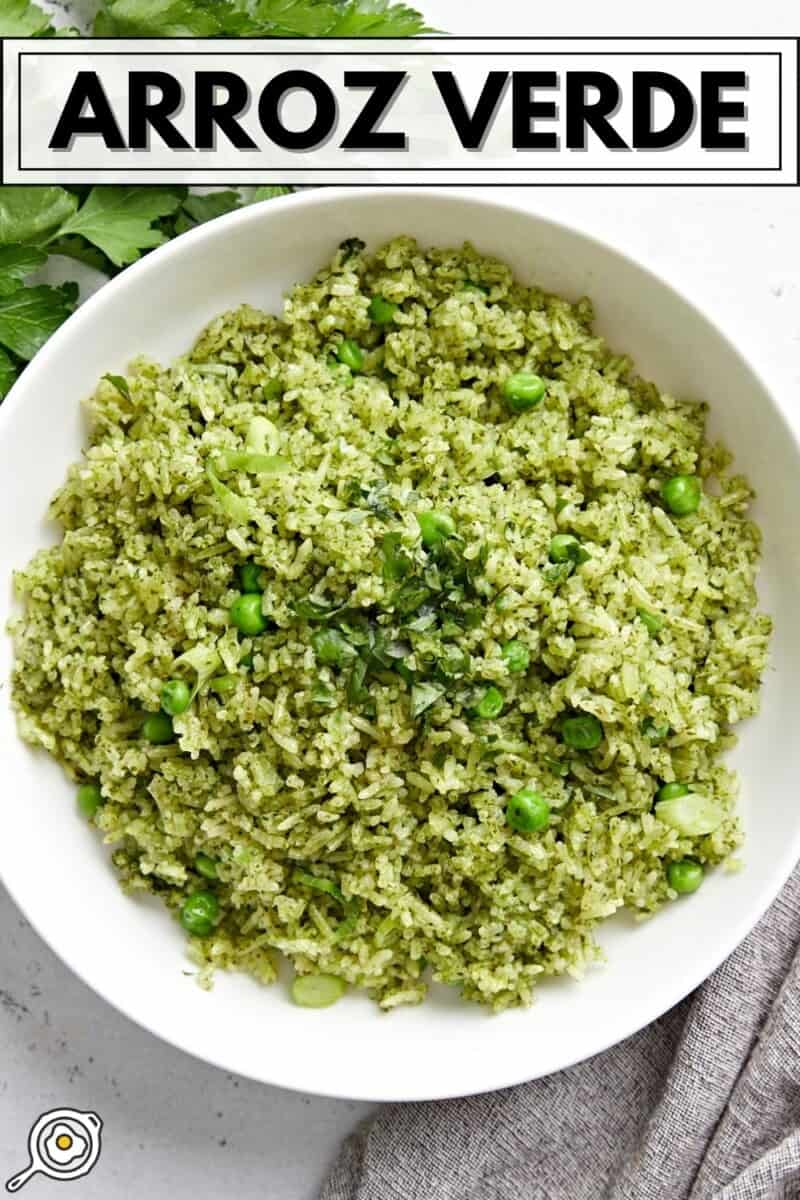 Overhead view of a white bowl full of Arroz Verde with title text at the top