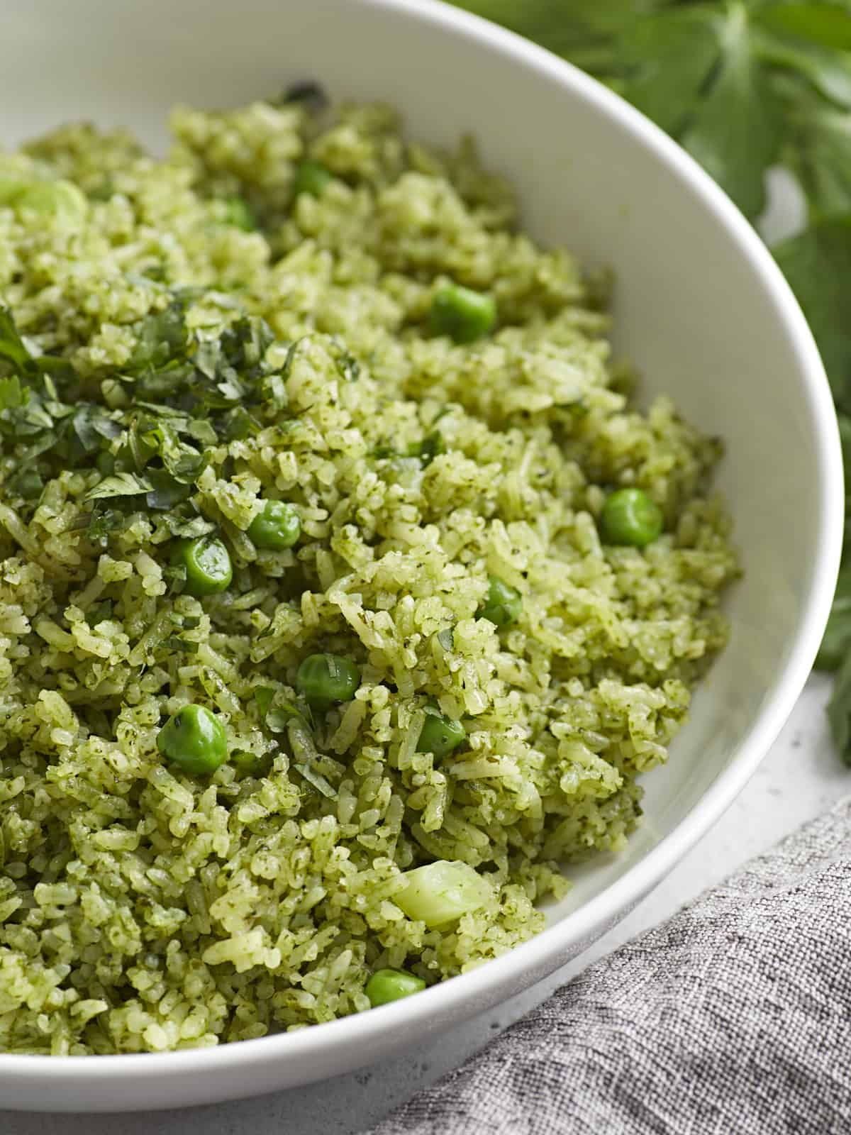 Close up side view of Arroz Verde in a serving bowl.