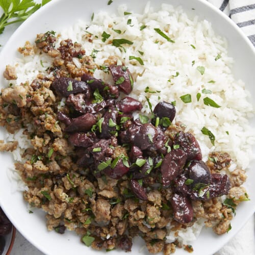 Close up overhead view of a pork and cherry rice bowl.