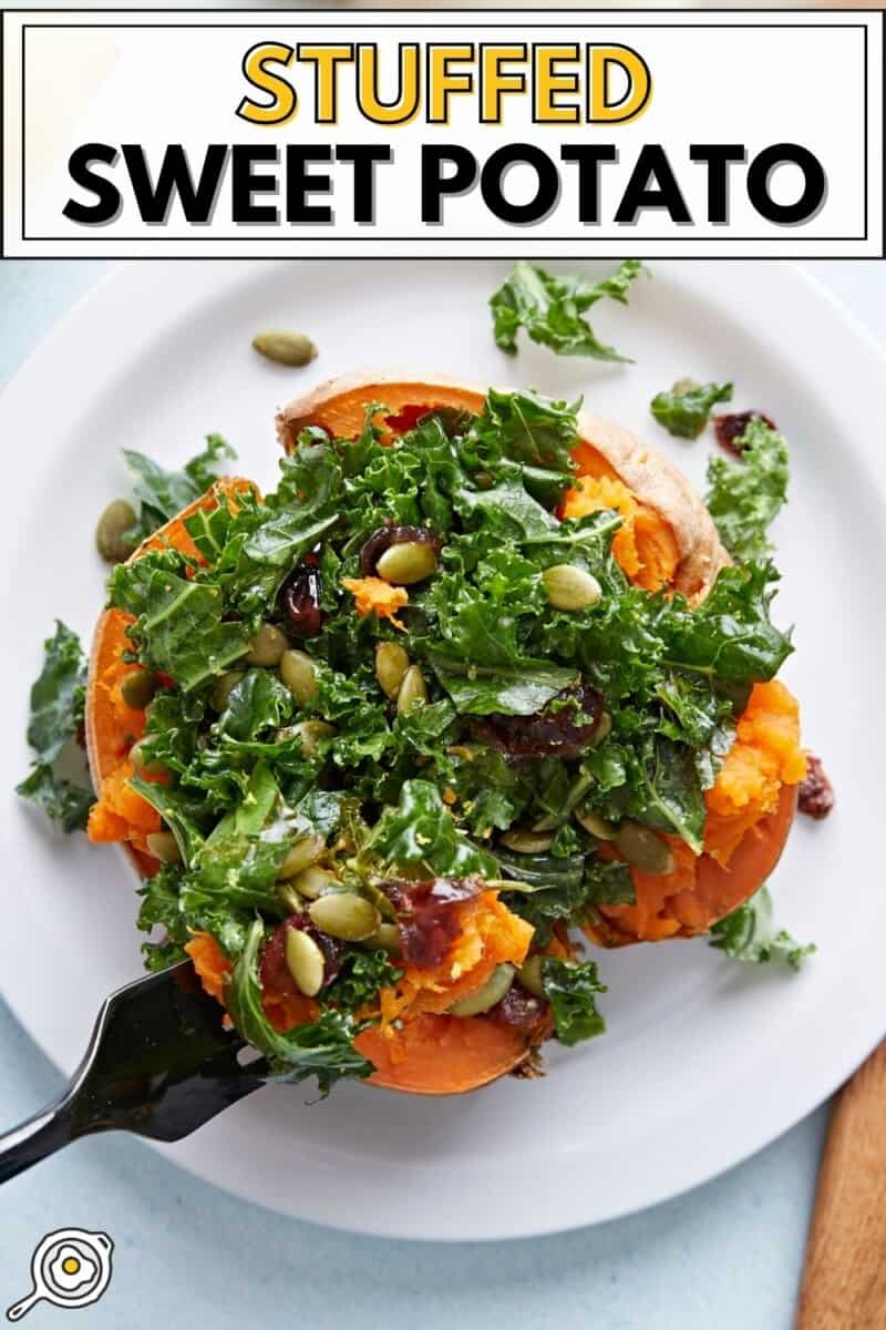 Stuffed sweet potato on a plate with a fork digging into the center.