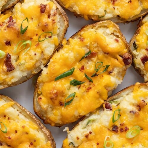 Close up overhead view of twice baked potatoes staked beside each other.