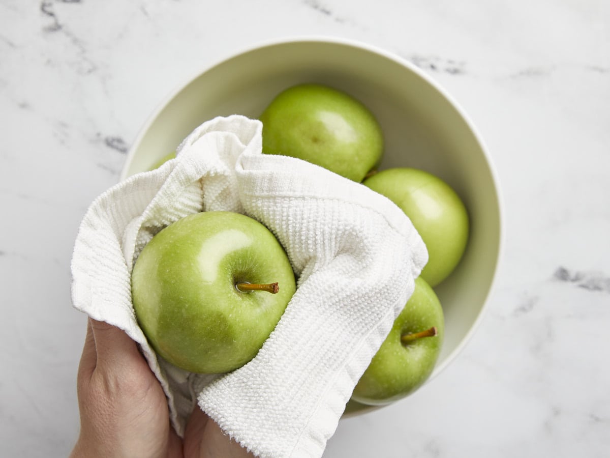 Apples being washed and dried. 