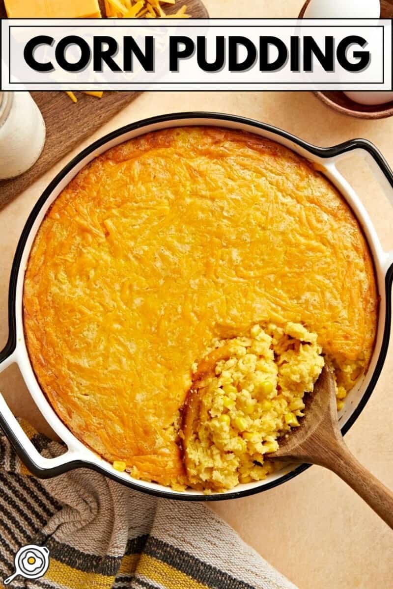 Overhead view of corn pudding being scooped out of the casserole dish.