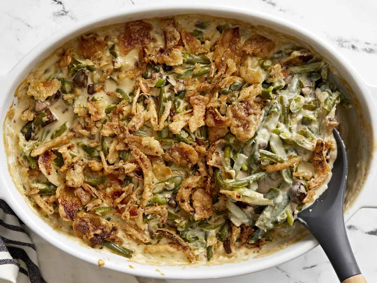 Overhead view of baked green bean casserole in the baking dish.