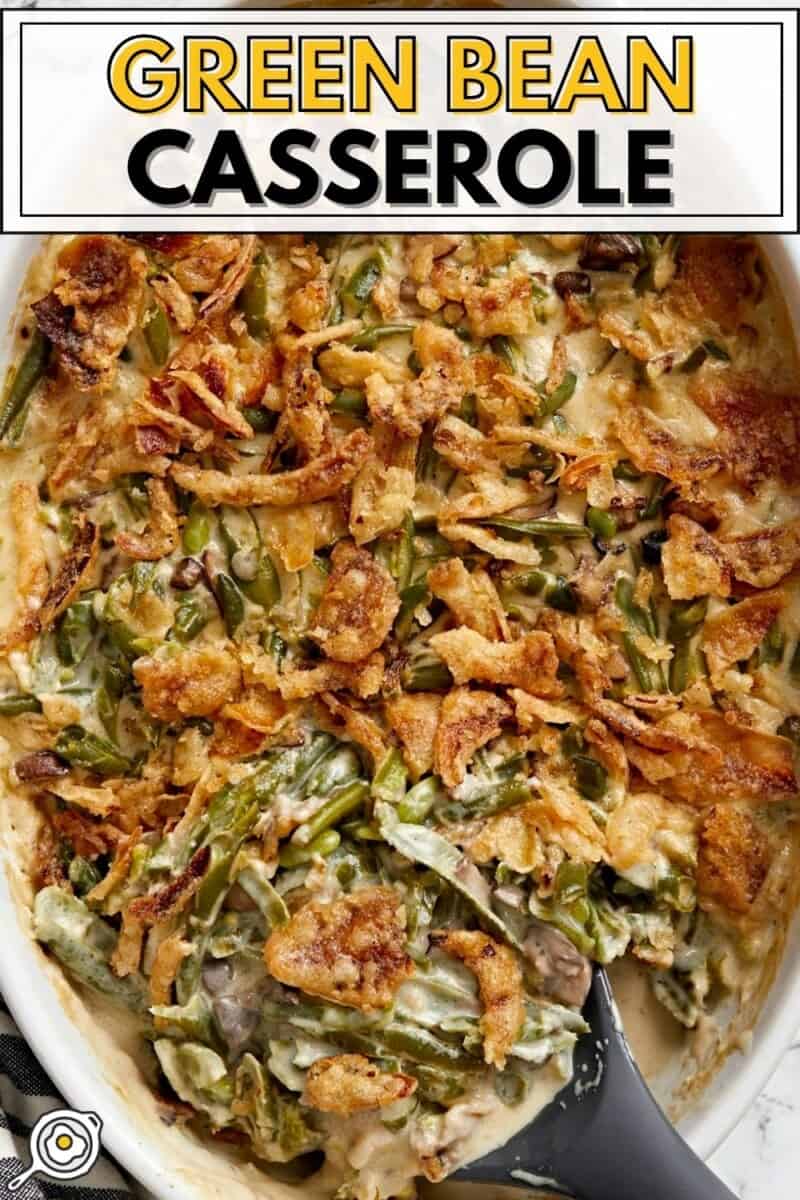 Overhead view of green bean casserole in the baking dish being scooped out.