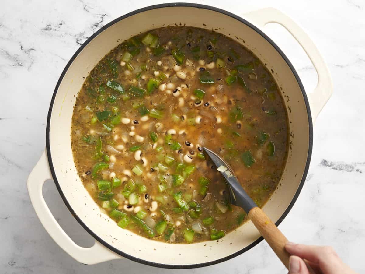 Ingredients being stirred in the pot before cooking. 