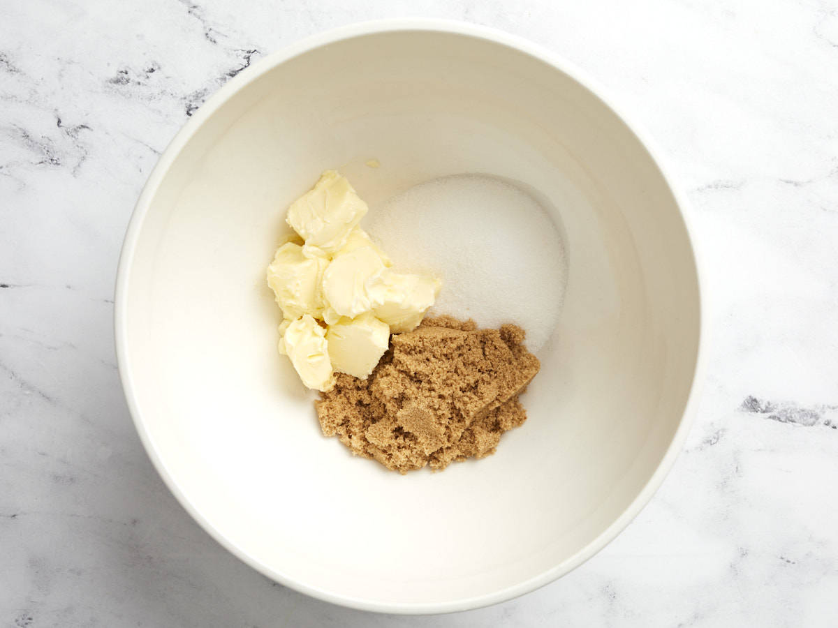 Butter, white sugar and brown sugar in a bowl.