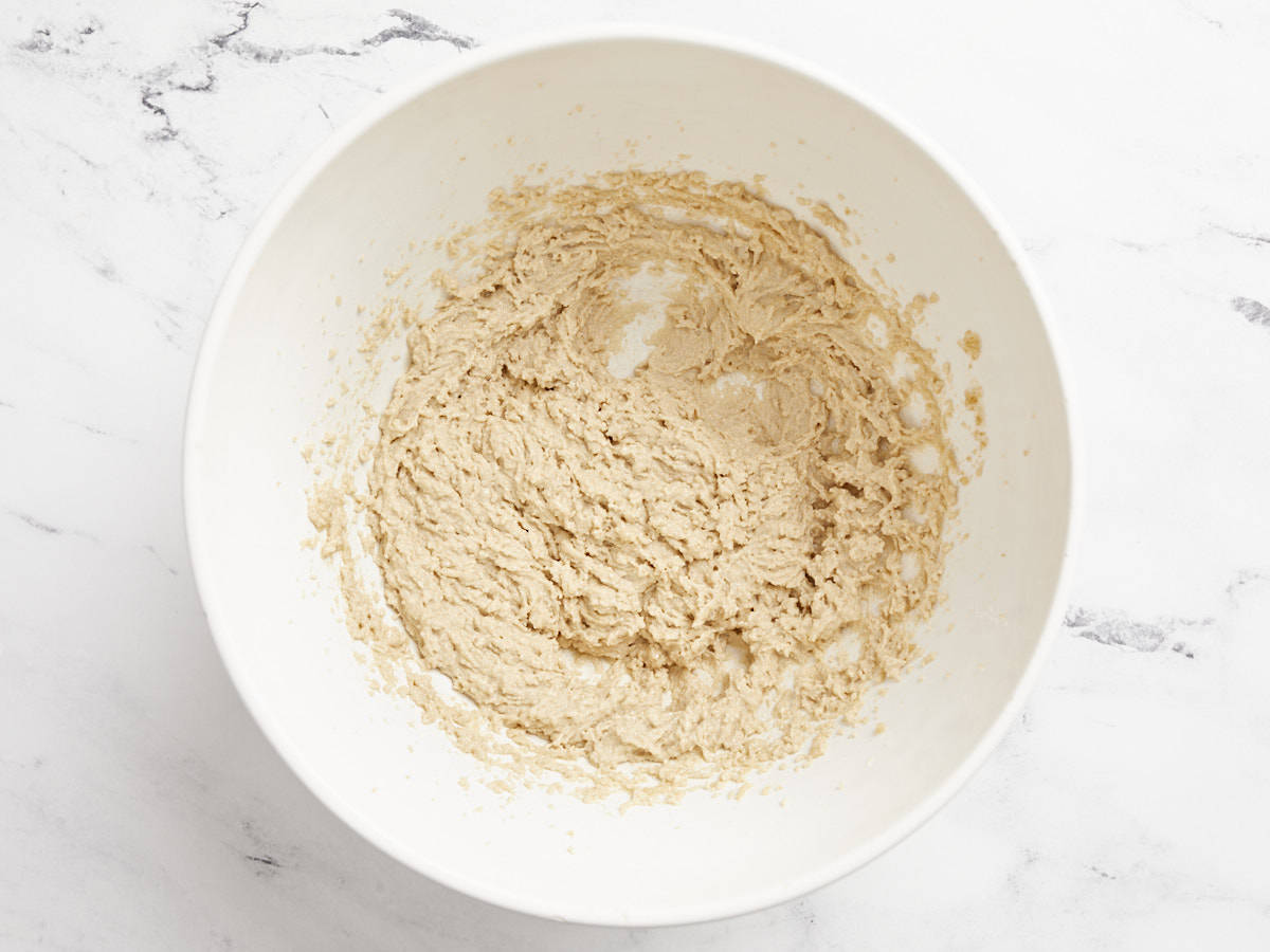 Creamed butter and sugars in the mixing bowl.