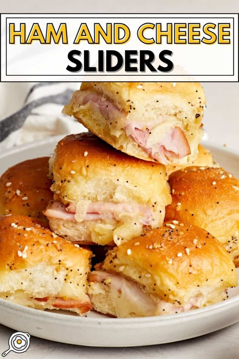 Front side view of a stack of ham and cheese sliders on a plate with title text at the top.