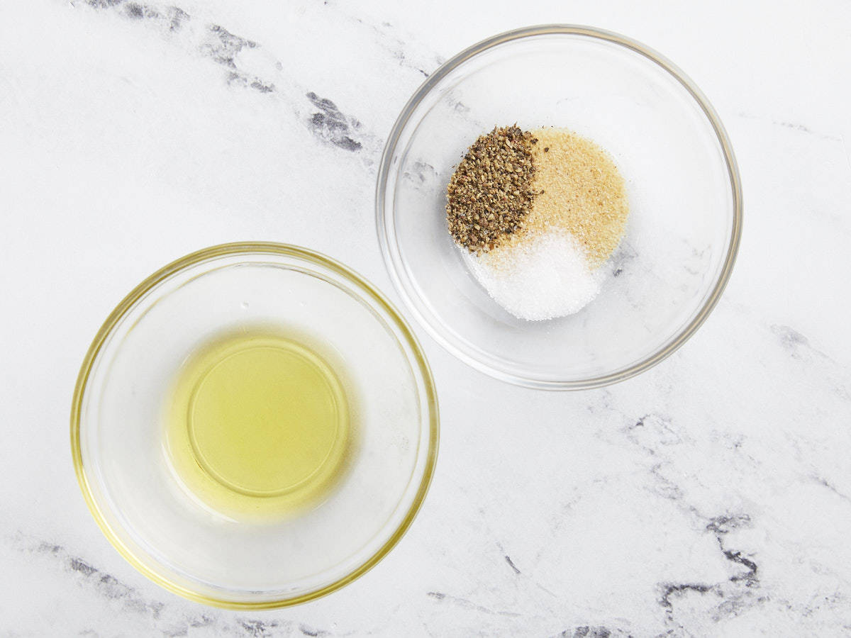 spices and oil in separate glass bowls.