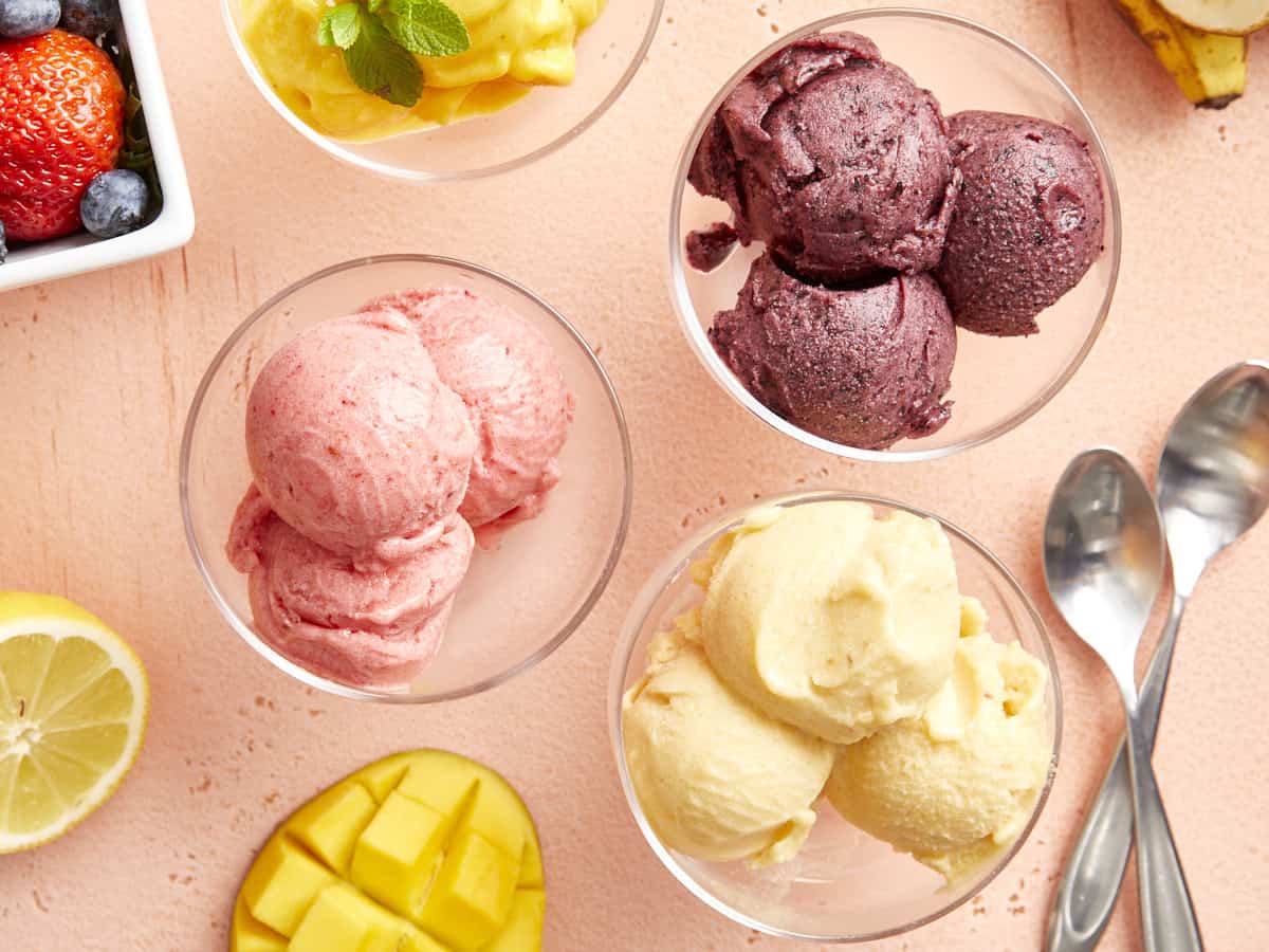 overhead view of different flavors of sorbet in glass coupes.