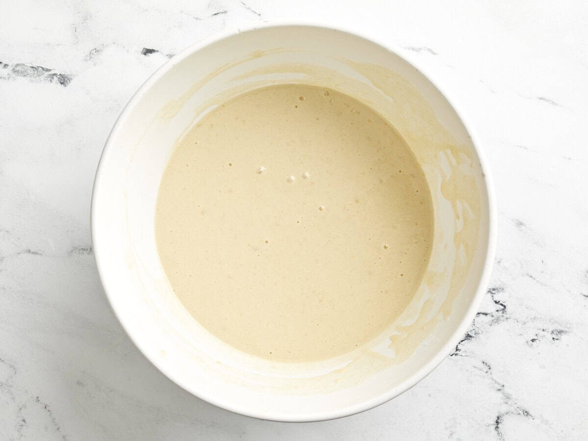 Sheet pan pancake ingredients mixed in a bowl.