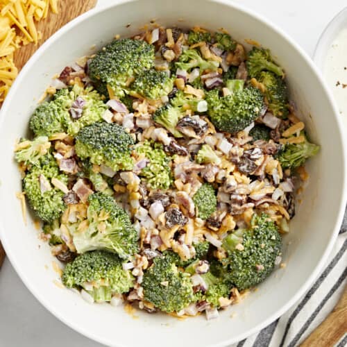 overhead view of broccoli salad in a white bowl.