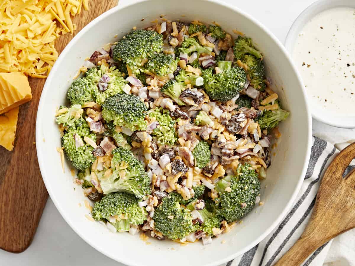 overhead view of broccoli salad in a white bowl.