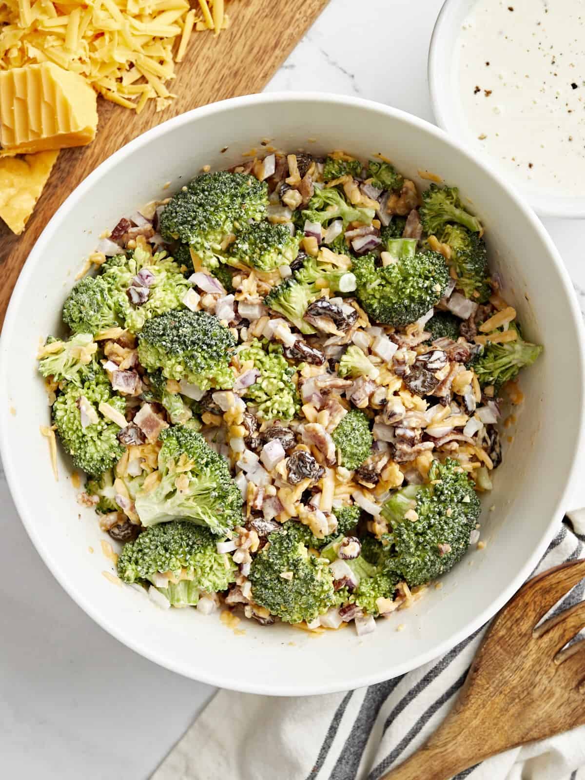 overhead view of broccoli salad in a white bowl.