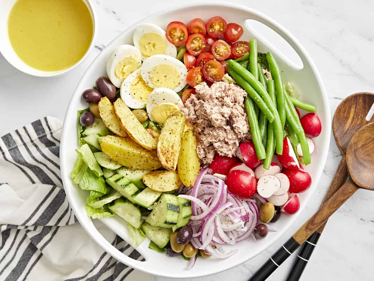 nicoise salad in a white bowl.