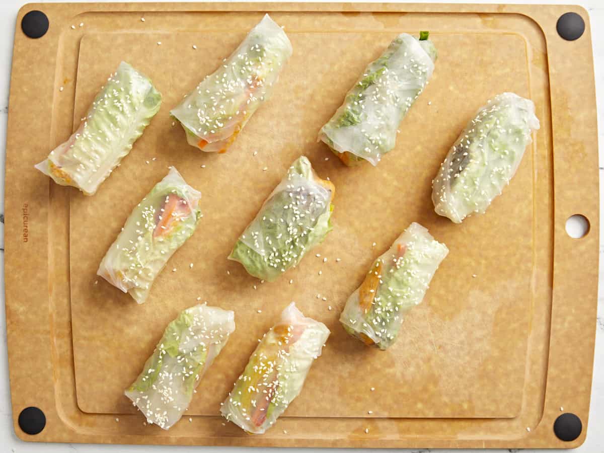 kimchi spring rolls on a cutting board.