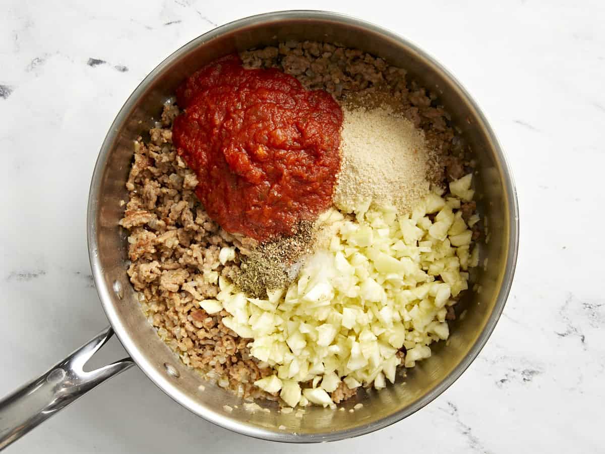 Zucchini flesh, marinara sauce, breadcrumbs, and seasoning added to sausage.