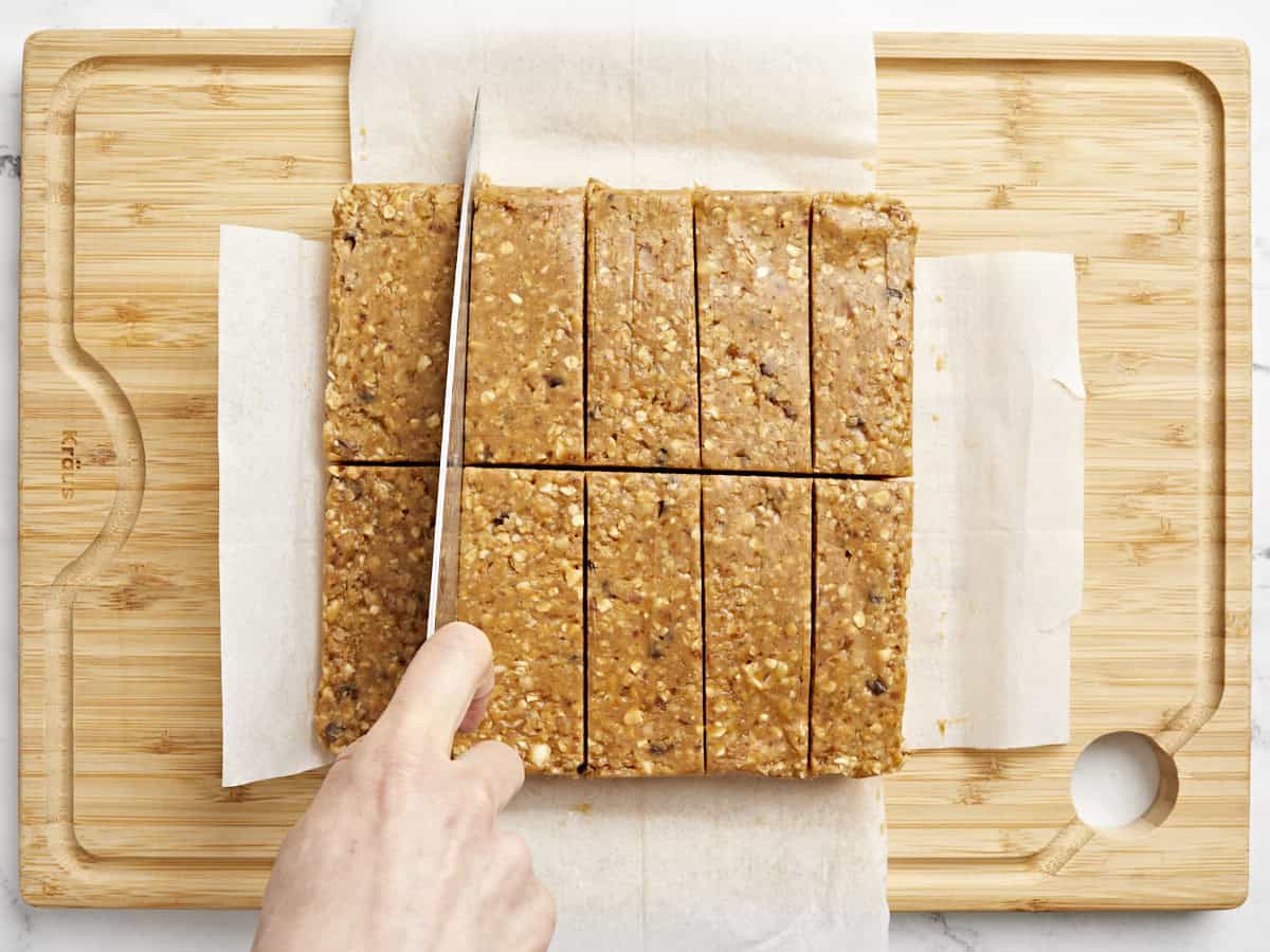 cutting granola bars on a cutting board.