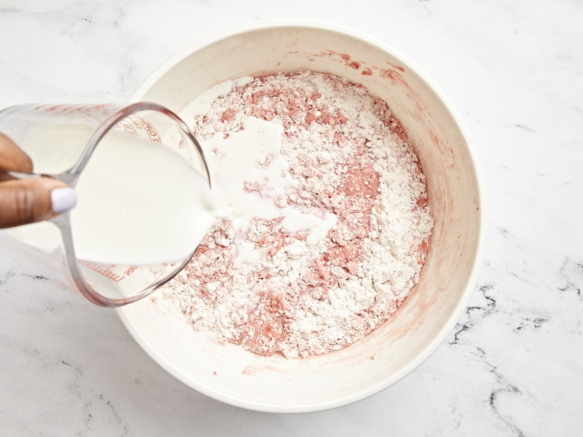 Milk added to the cake batter bowl.