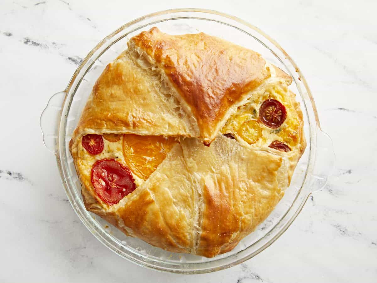 tomato pie in a glass pie pan.