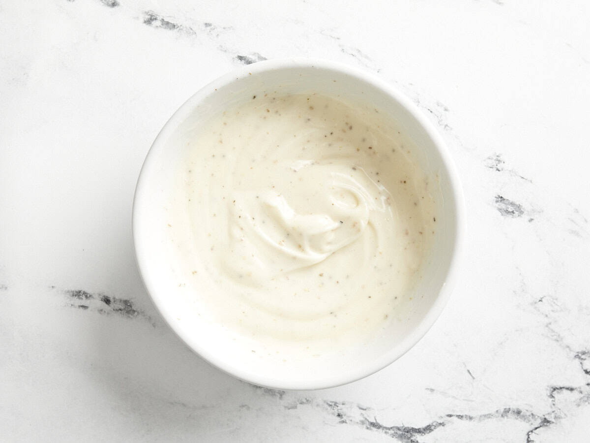 Dressing for chicken salad in a bowl.