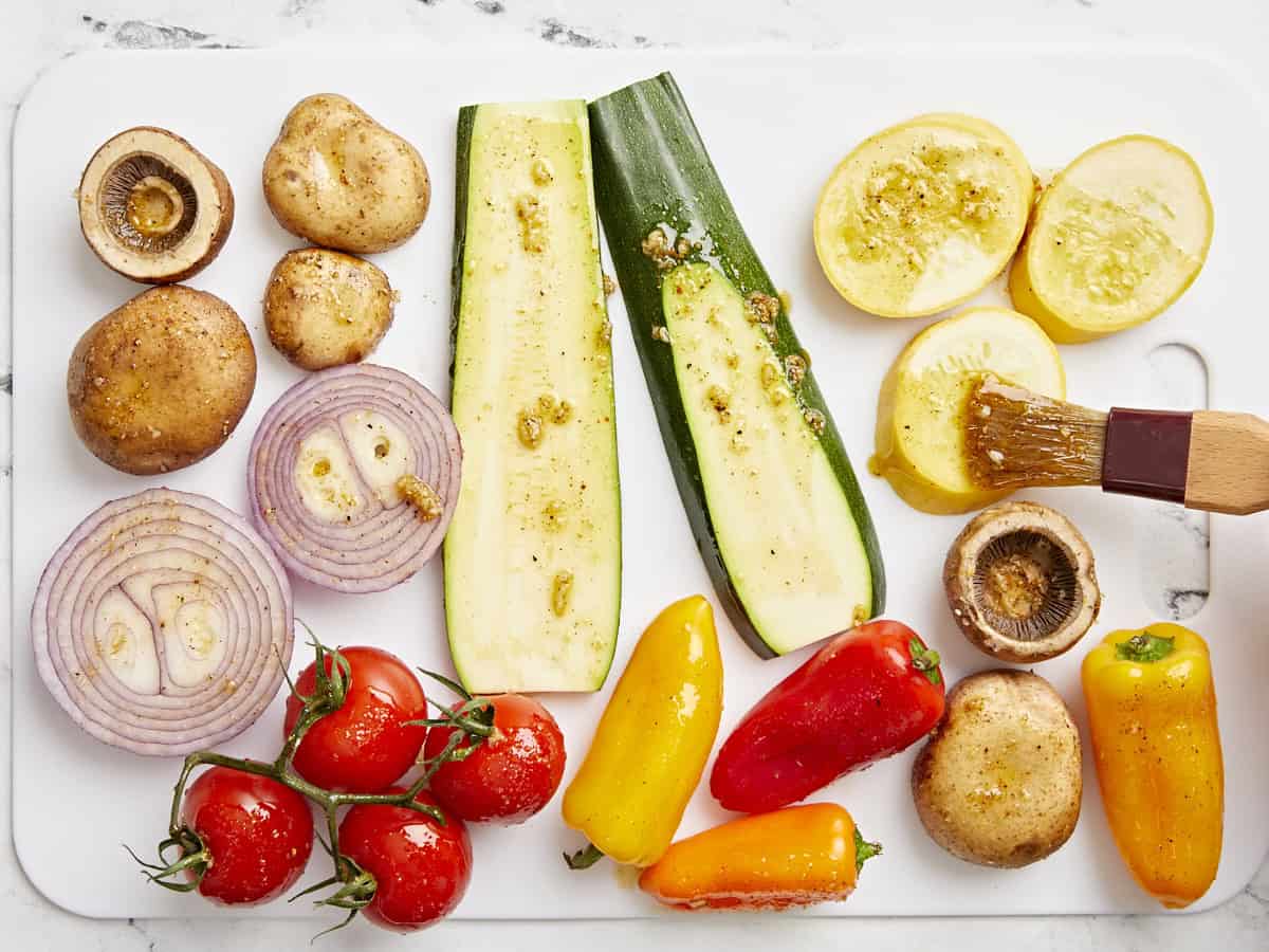 Sliced vegetables brushed with a marinade.