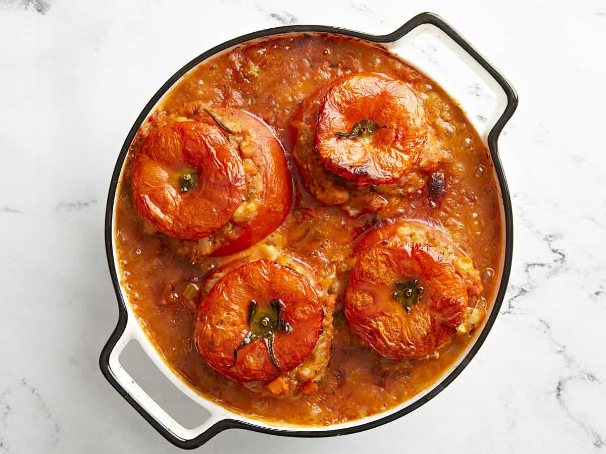 Tuscan white bean stuffed tomatoes in a baking dish.