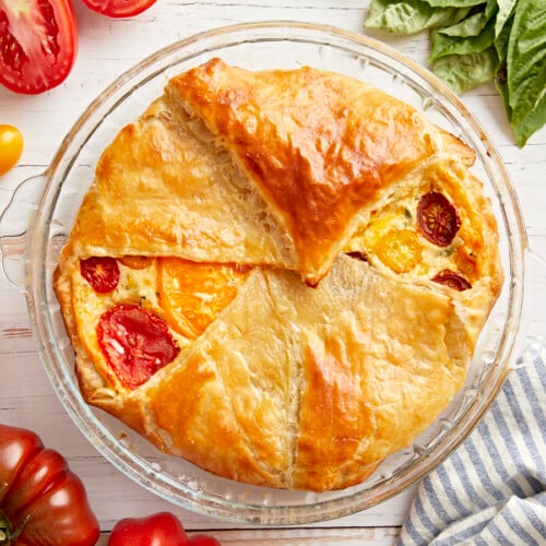 Overhead shot of a delicious tomato pie on a table.