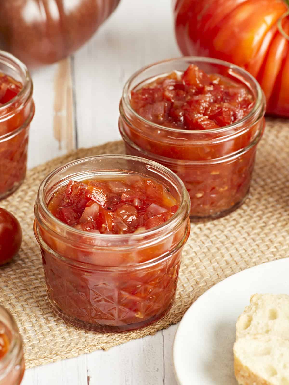 Tomato relish in glass jars.