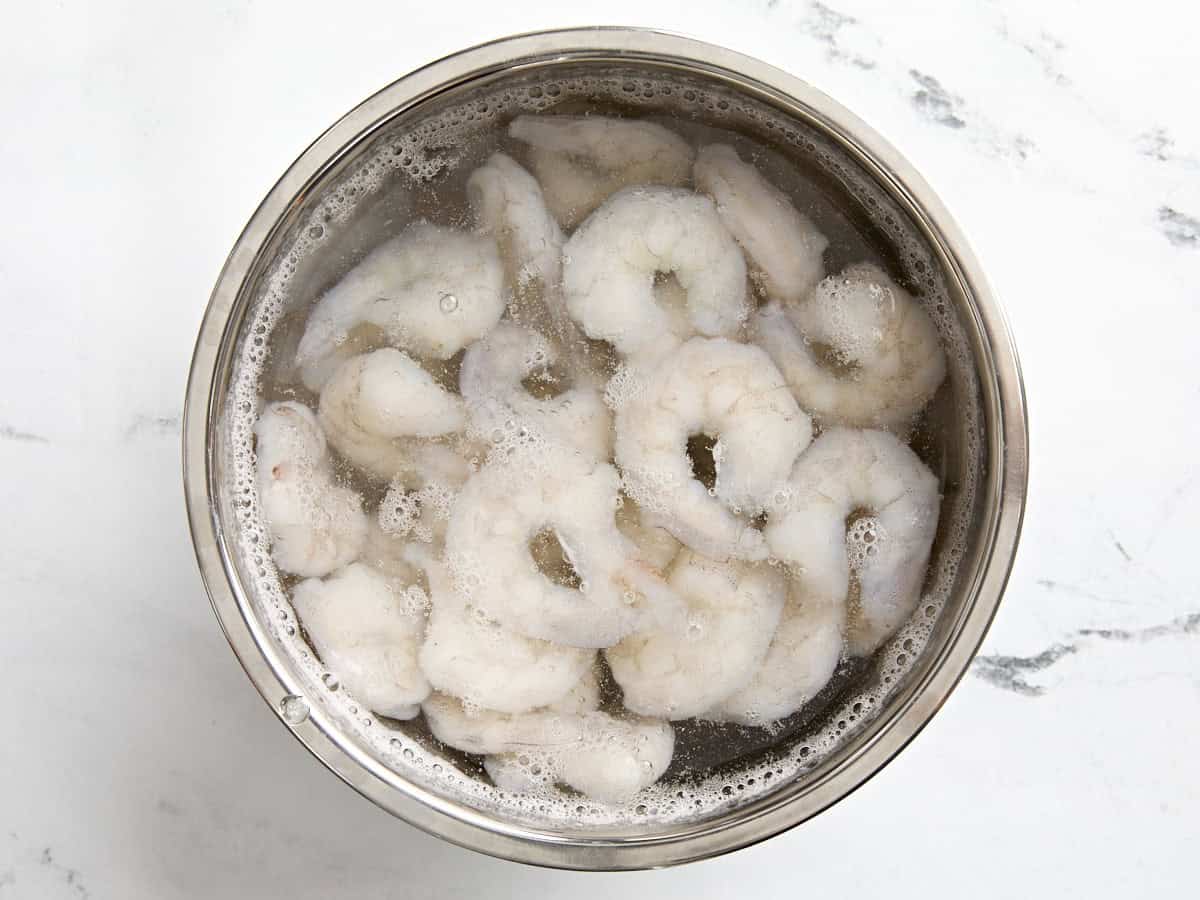 Shrimp defrosting in water