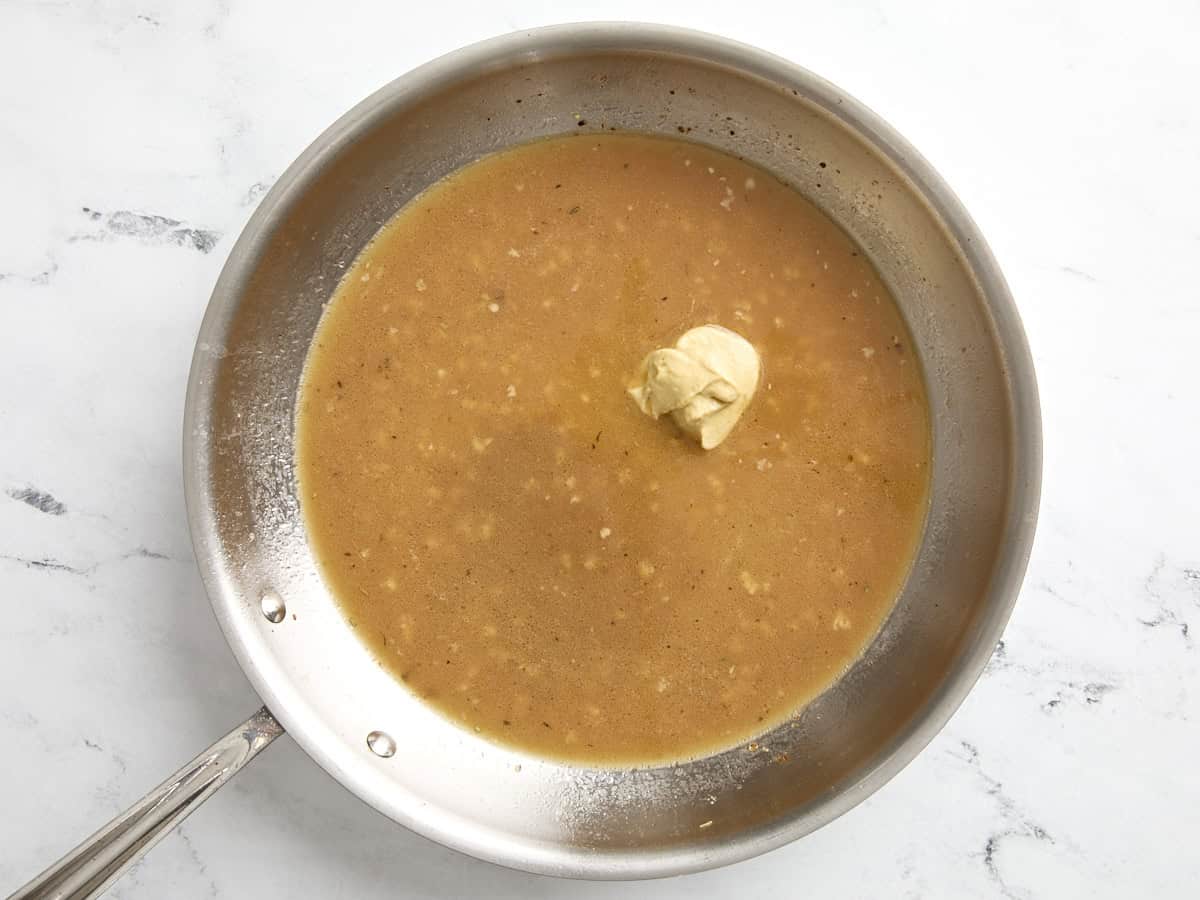 Chicken broth, dijon mustard and Worcestershire sauce added to skillet. 