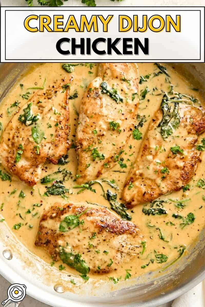 Overhead view of creamy dijon chicken in a skillet with title text at the top.