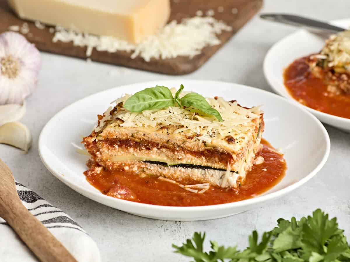 Side view of a slice of zucchini lasagna on a plate