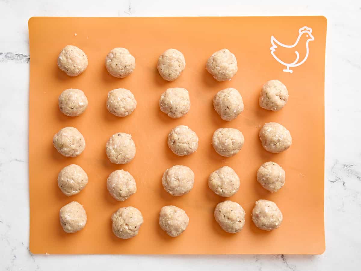 chicken meatballs on a cutting board.