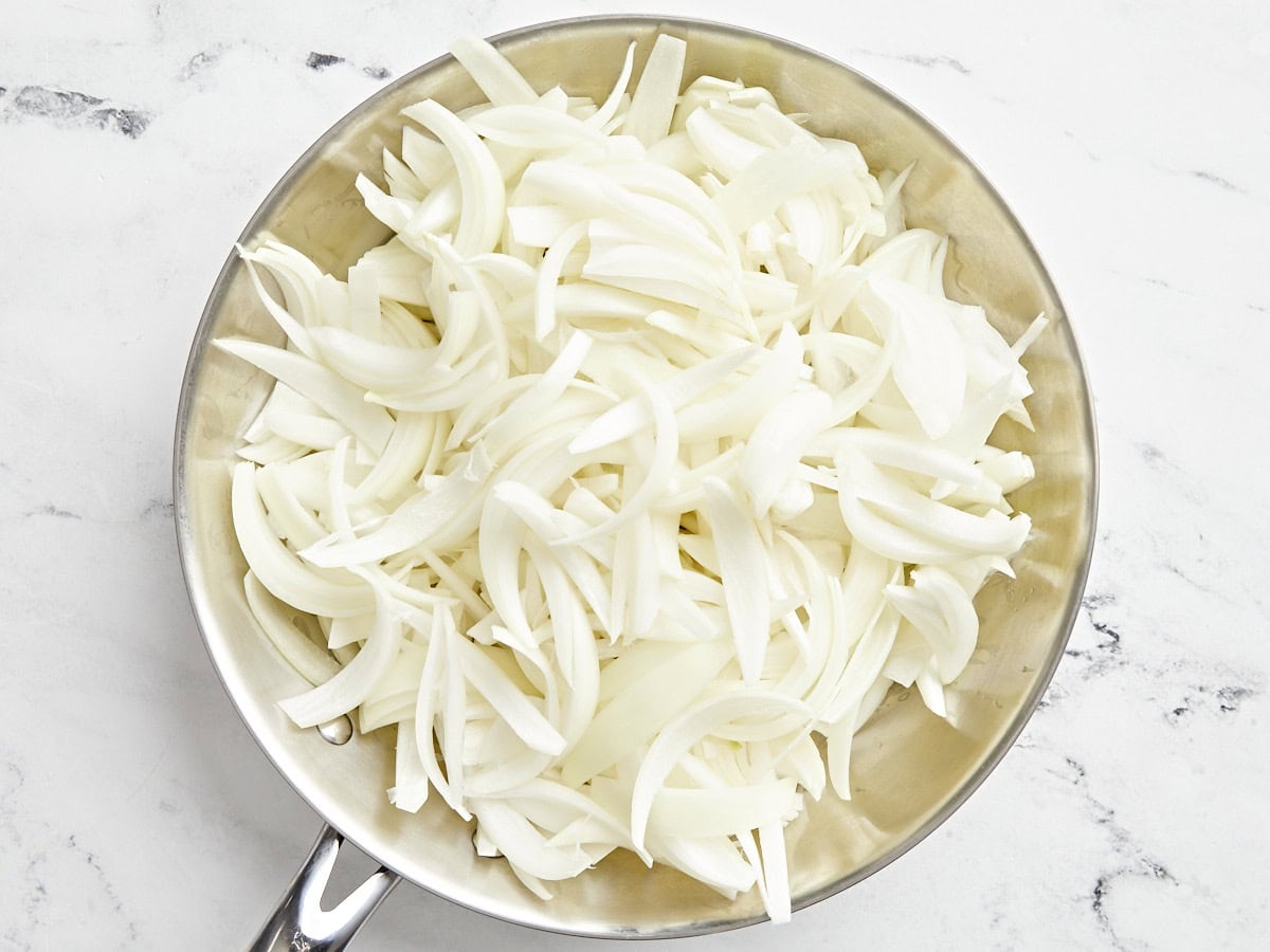 Sliced onions in a pan.