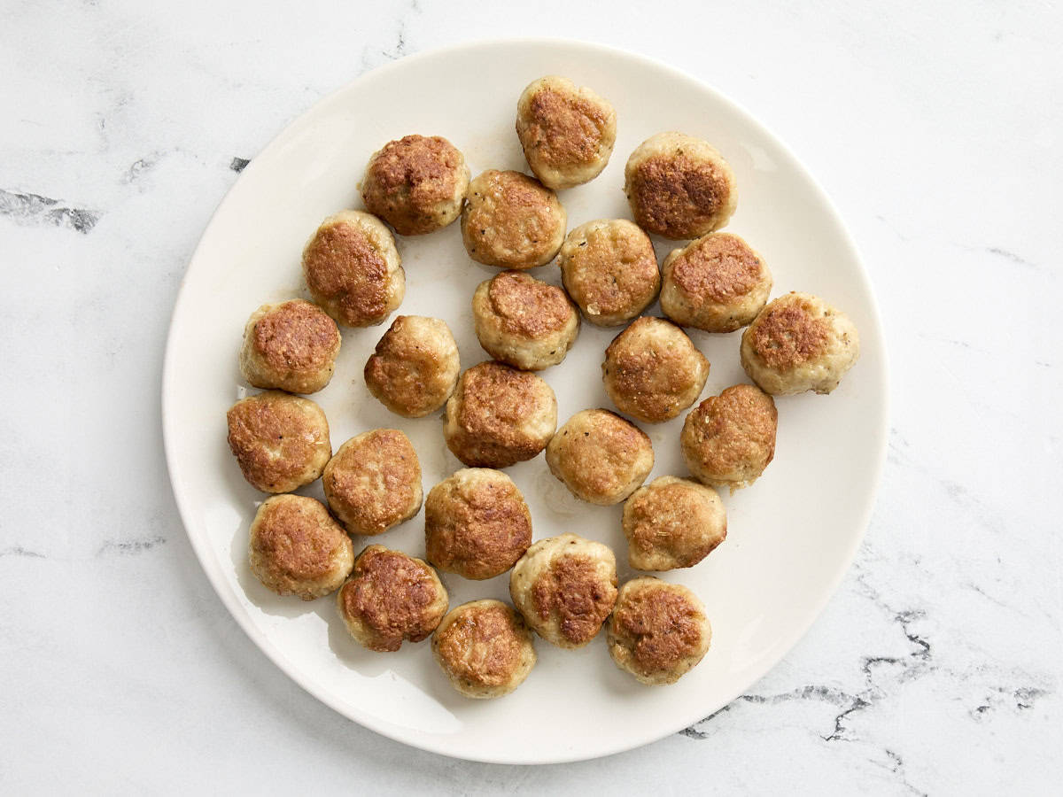 cooked chicken meatballs on a plate.