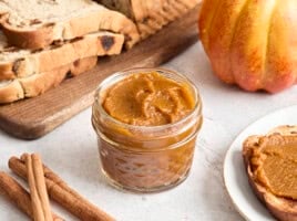 Side view of a jar of pumpkin butter.