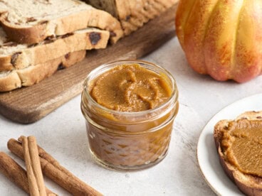 Side view of a jar of pumpkin butter.