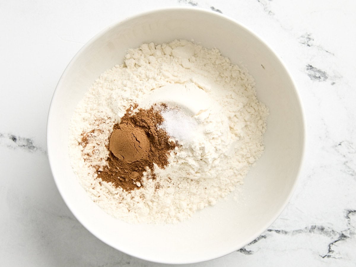 Flour and cinnamon in a mixing bowl.