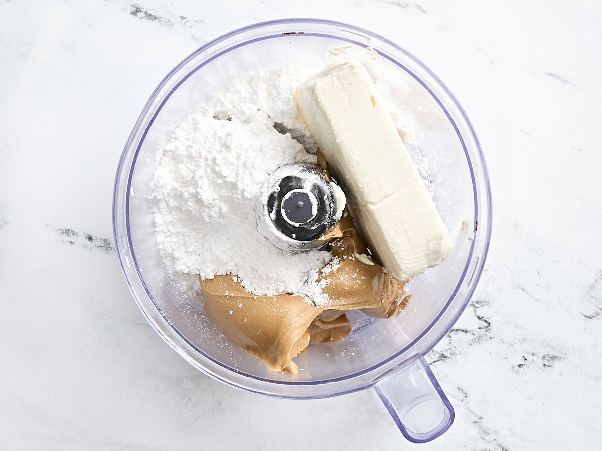 Powdered sugar, cream cheese, and peanut butter in a food processor.