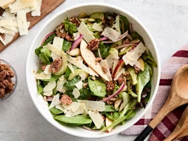 Overhead view of pear celery pecan salad in a serving bowl.