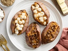 Overhead view of Twice Baked Sweet Potatoes on a white platter.