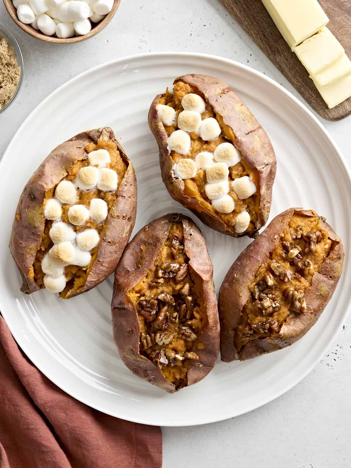 Overhead view of Twice Baked Sweet Potatoes on a white platter.