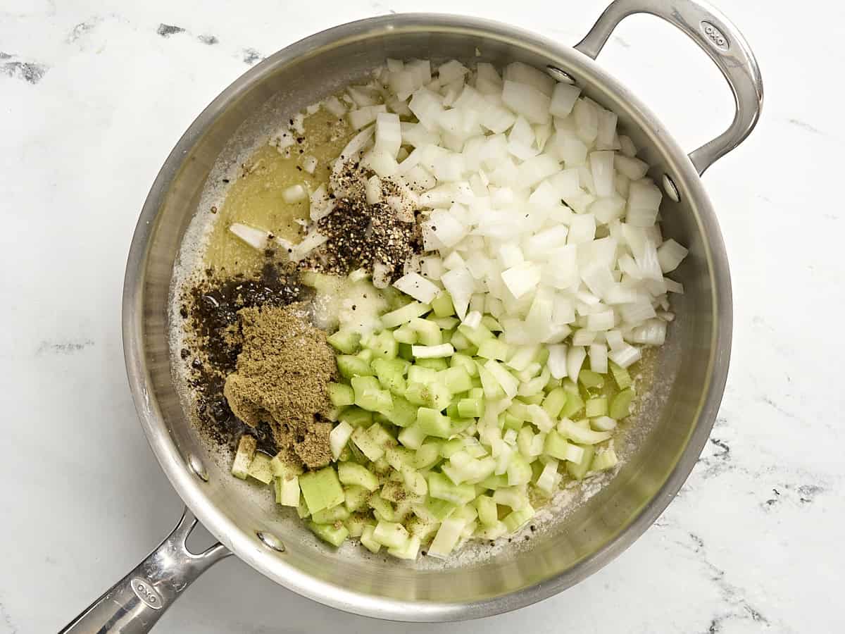 Diced onion, celery, garlic, and seasonings in a skillet.